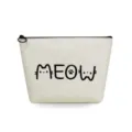 Close-up detail of beige canvas cosmetic pouch featuring cute cat lettering print and black zipper. - Meow Letter Print Style (sn3340)