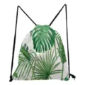 Close-up detail of tropical green monstera leaf pattern on white drawstring backpack fabric. - White Cloth Tropical Green Leaf Style (sk4795)