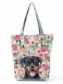 Gros plan détaillé du sac cabas en toile élégant avec imprimé floral de chien et anses grises. - Style Structuré Rottweiler Floral Rétro (hl2992)