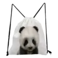 Close-up detail of white canvas drawstring backpack featuring adorable baby panda face print. - Panda Style (sk2765)