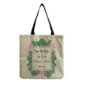 Detail view of the cotton linen tote bag featuring tropical leaf print and custom wedding text. - Natural Linen Tropical Floral Wedding Custom Style (hm0998)