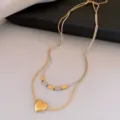 Collier double couche en acier inoxydable cœur, chaîne clavicule géométrique minimaliste femme. - Collier - doré - cœur argenté