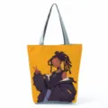Detail view of the anime dark skin girl print canvas tote bag, trendy casual shoulder bag. - Yellow Anime Illustration Style (hlk0508)