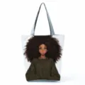 Canvas tote bag detail shot showing the stylish black girl anime print and gray shoulder straps. - White Curly Hair Illustration Style (hlk0512)