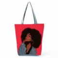 Detailed view of the stylish canvas tote bag featuring a chic curly hair girl print graphic. - Red Curly Hair Illustration Style (hlk0519)