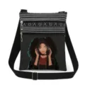 Close-up of black crossbody bag detail featuring anime girl print and double zippers. - Style (xkk0786)