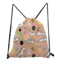 Close-up detail of cute cartoon dinosaur and pineapple print pink drawstring backpack. - Light Pink Dinosaur Pineapple Graffiti Style Ten (sk5331)