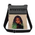 Detail view of stylish black girl print canvas crossbody bag with dual zippers and strap. - Style (xkk0789)