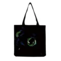 Close-up detail of black canvas tote bag featuring glowing green cat eyes print, casual style. - Black Green Glowing Eyes Pet Style (hm3071)