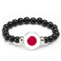 Black beaded bracelet with Japanese flag charm, elastic rope fashion accessory for daily wear. - Japan Flag Style (Style 20) / Black