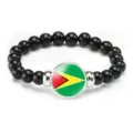 Guyana flag beaded stretch bracelet with black beads and central glass cabochon pendant. - Guyana Flag Style (Style 38) / Black