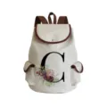 Canvas backpack featuring a letter C and floral print design, ideal for daily school and travel use. - Letter C Print Style (sj2460)