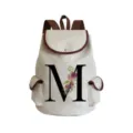 Canvas floral letter M backpack detail view, brown trim design, casual daily use - Letter M Print Style (sj2470)