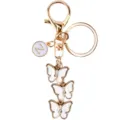 Portachiavi in metallo dorato con ciondolo lettera Z e tre pendenti a farfalla con strass. - Stile Z / Bianco