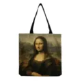 Gros plan de l'impression d'art de Mona Lisa sur un sac en toile avec des lanières noires. - Style Imprimé La Joconde (hm3002)
