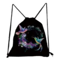 Close-up detail of black drawstring backpack featuring hummingbird floral print and faith text. - Hummingbird & Flower Circle Print (sk4804)