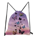Detailed closeup of the butterfly print drawstring backpack featuring pink sky design and black cords. - Pink Purple Cloud Butterfly Print (sk4808)