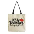 Detailaufnahme der Lehrertasche mit Apfel-Druck, aus Canvas mit schwarzen Trägern. - Best Teacher Ever Apfel Stil (hm5432)