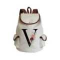 Detailed view of canvas backpack featuring floral letter V print and brown leather trim. - Letter V Print Style (sj2479)