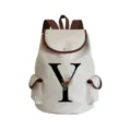 Detailed view of canvas backpack featuring floral letter Y print and brown leather trim. - Letter Y Print Style (sj2482)