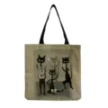 Detailed view of canvas tote bag with retro cat art print and black shoulder straps - Cat Band Print (hm9281)