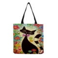 Canvas tote bag detail showcasing artistic black cat and colorful floral print pattern. - Vintage Colorful Flower Black Cat Print (hm9299)