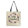 Detailansicht der Lehrertasche aus Leinen, Blumenkranz-Druck, stabile schwarze Tragegriffe. - Future Teacher Kranz Stil (hm5437)