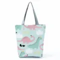 Simpatica borsa shopper in tela con stampa dinosauro da donna, grande borsa a spalla. - Gruppo di Dinosauri Celeste (hl0337)
