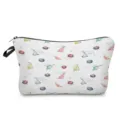 Close-up view of the cute dinosaur and planet watercolor print makeup pouch detail. - Dinosaur Style 2