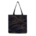Detail of dark blue canvas tote bag featuring elegant golden wave pattern and black handles. - Japanese Waves(hm6452)