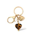 Modieuze luipaard hart hanger sleutelhanger, retro gouden tas bedeltje voor dames. - Hart sleutelhangers met panterprint