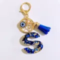 Blue letter S keychain with evil eye charm and tassel stylish accessory for bags and keys - Letter S