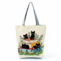 Close-up of cute black cat and books print canvas tote bag, detail of fabric texture and print. - Black Cat and Books (hlk2476)