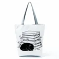 Black cat printed canvas tote bag, stylish washable casual shoulder shopping handbag. - Black Cat and Book Stack (hlk2478)
