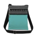 Detailopname van canvas schoudertas met zwart-witte strepen en turquoise zak. - Z/W Geometrische Blauwgroene Stijl (xk3679)
