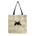 Cute black cat canvas tote bag with musical notes print, casual eco-friendly shopping bag. - Cat And Staff (hmk2953)