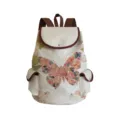 Close-up view of canvas backpack featuring floral butterfly print and brown leather trim details. - Beige Floral Butterfly Style (sjk0434)