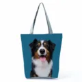 Close-up detail of the adorable dog graphic print canvas tote bag with durable sturdy handles. - Tricolor Shepherd Dog Print (hl7380)