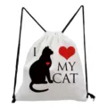 Close-up detail of white canvas drawstring backpack featuring cute black cat silhouette print. - White Black Cat Silhouette Heart (sk3557)