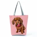 Dachshund dog print detail view on pink tote bag with stylish grey shoulder straps. - Pink Background Dachshund Licking Nose Print (hl7384)