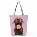 Detailed shot of the stylish tote bag with a cute dog print and grey straps for daily use. - Pink Background Funny Brown Dog Print Style (hl7390)