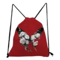 Close-up detail of the red drawstring backpack featuring a stunning black and white rose butterfly print. - Red And Black Butterfly Print Style (skk0431) / Red