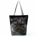 Detailed view of canvas tote bag featuring realistic grumpy cat face print and handles. - Black Cat Print (hl5091)