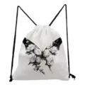 White canvas drawstring backpack featuring a chic black and white floral butterfly print. - Black And White Rose Butterfly Print Style (skk0432) / White