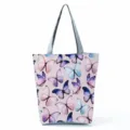 Detailed close-up view of a fashionable fabric shoulder bag with colorful butterfly prints. - Shoulder Tote Style (hlk2713)