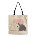 Detalle de bolso de lona con estampado de conejos lindos y correas de hombro negras. - Conejos Abrazándose (hm6836)