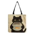 Close-up of the cute black cat print canvas tote bag, showing the playful fishbowl design. - Cat With Goldfish Bowl (hmk2999)