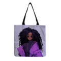 Stylish canvas tote bag featuring unique purple illustration print and sturdy black shoulder straps. - Black Illustration Style (hmk2778)
