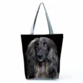 Detailed view of large capacity black dog print canvas shoulder tote bag with zipper closure. - Longhair Dog Print (hl5109)