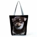 Close-up detail view of the cute dog print canvas tote bag with sturdy grey handles. - Shiba Inu/Akita Print (hl5110)
